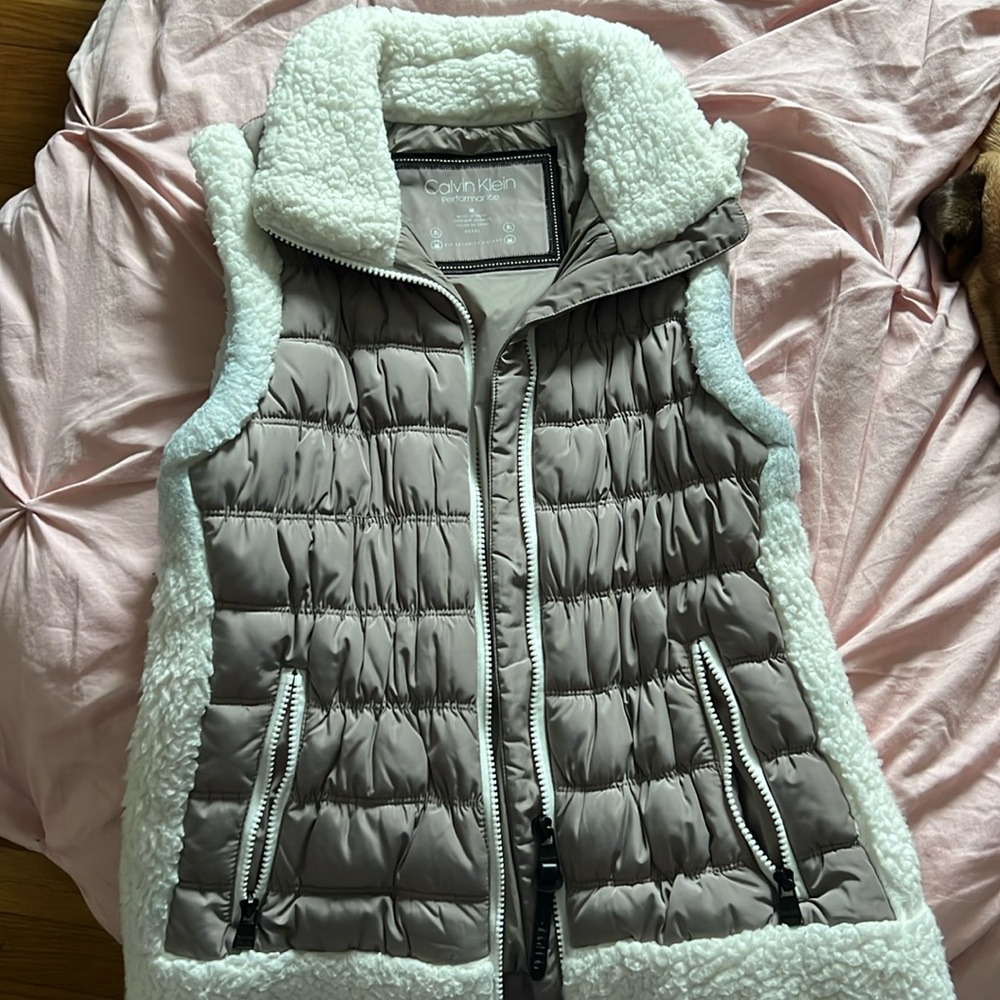 Worn a couple times. Stains under the arms from shirts rubbing against it.